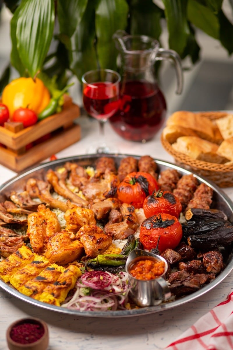 Beef, chicken kebab, bbq with roasted, grilled potatoes, tomatoe